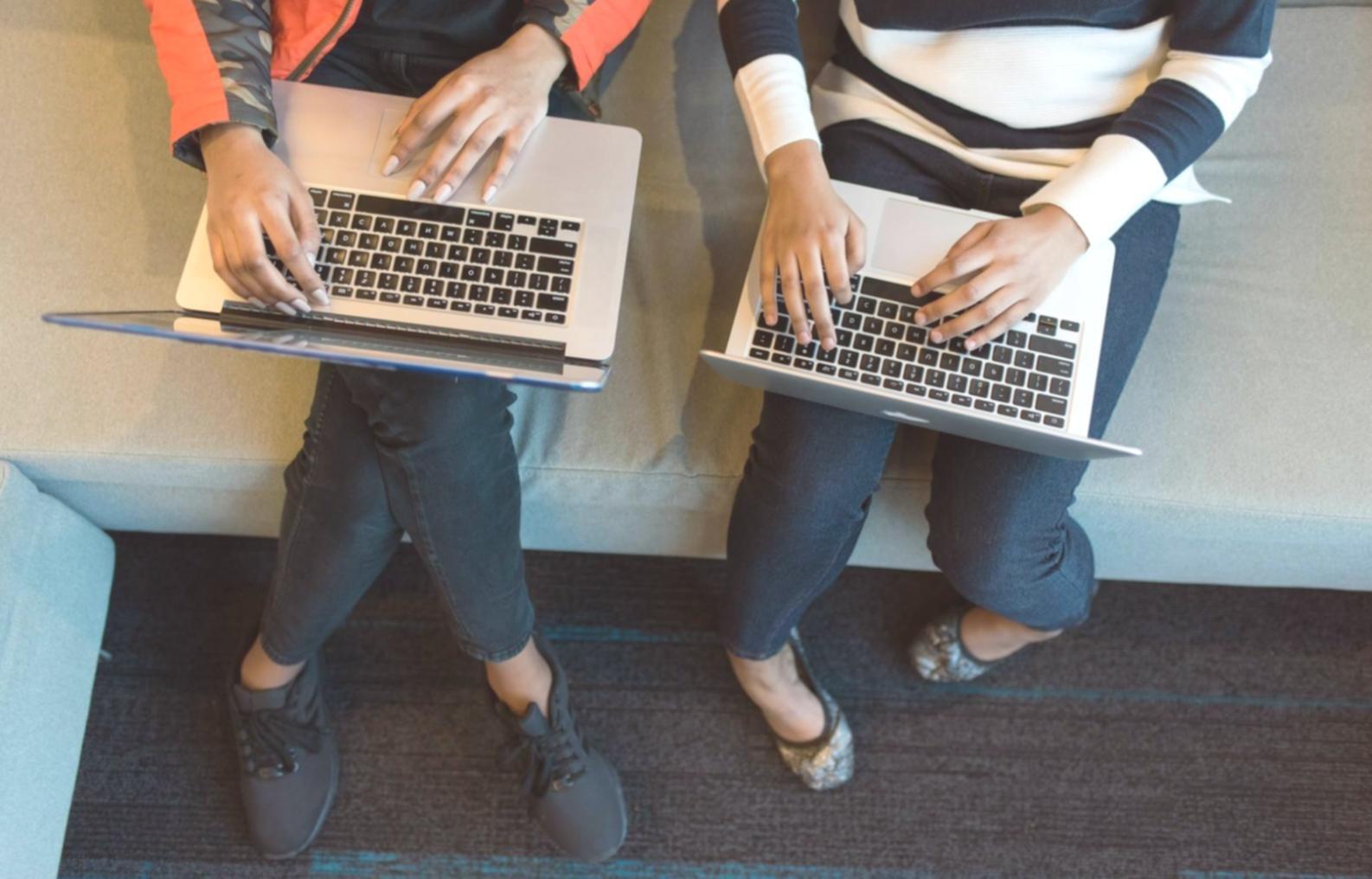 Students collaborating on accessibility testing with assistive technology devices