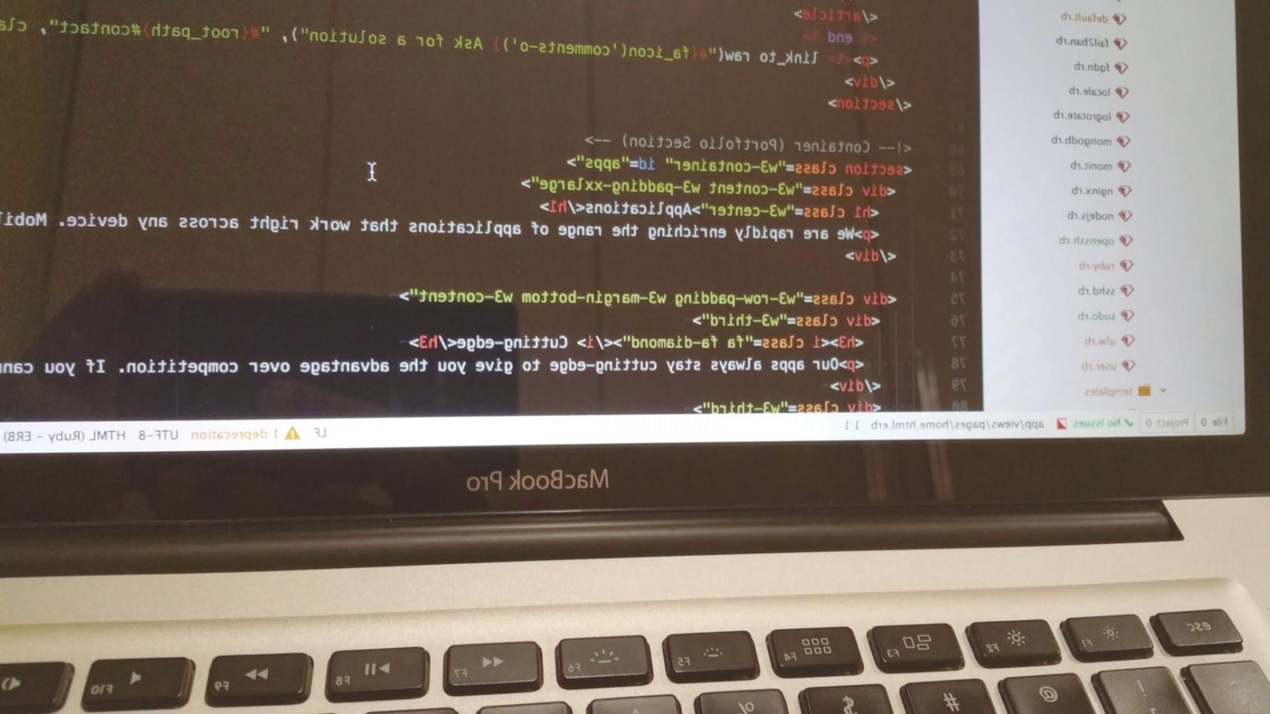 Modern laptop setup with accessibility testing tools displayed on screen